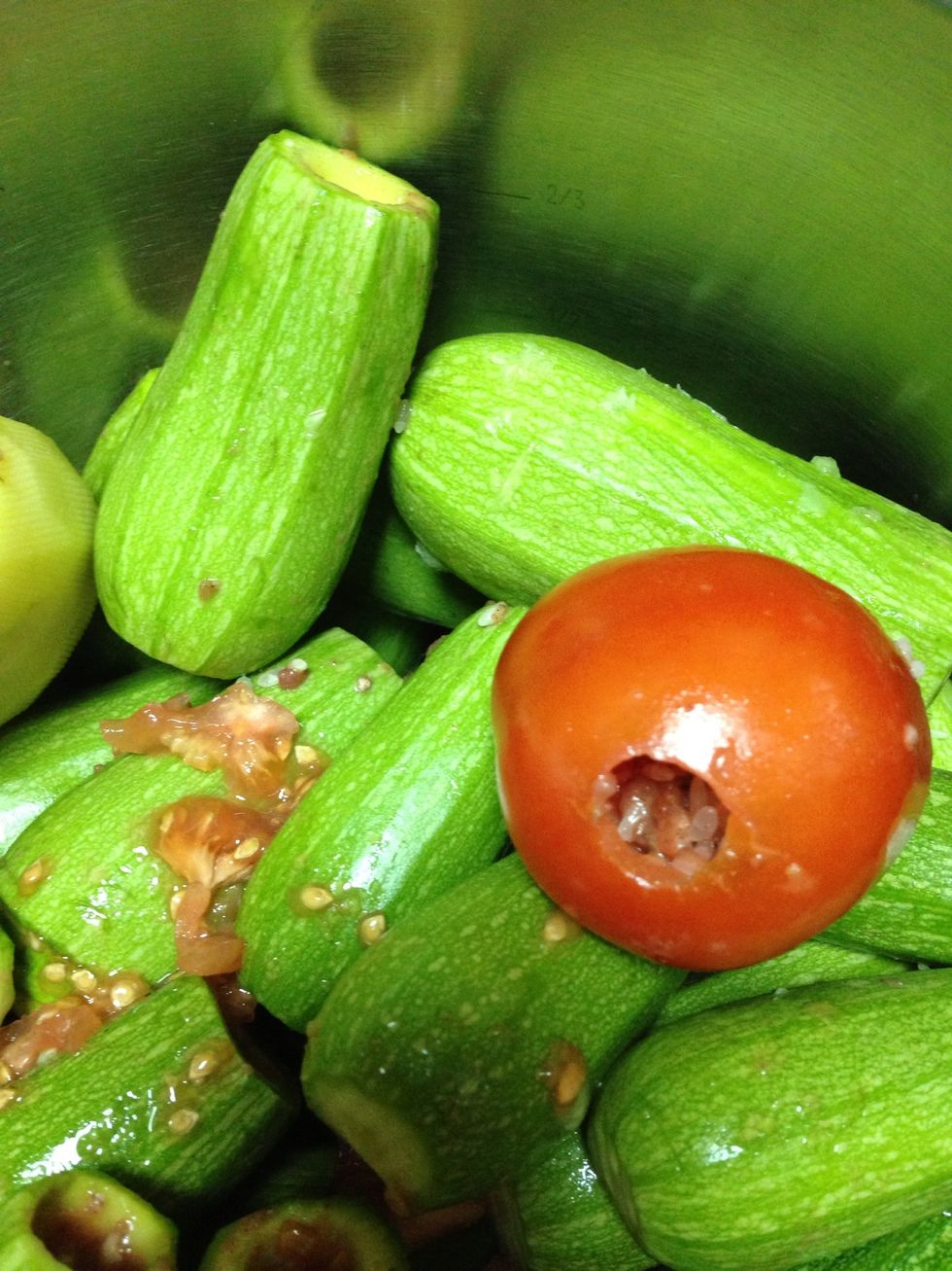 Mix rice and meat add salt and pepper and 2 tablespoons vegetable oil and 1/4 cup water  Fill each zucchini up to 2/3 bevause rice will grow in size when cooked