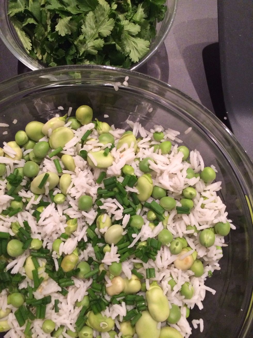 Mix rice with beans add the chives and coriander. Personally I like it without any dressing. I like the taste of raw fresh green new season beans... OR...a drizzle of garlic flavored oil.