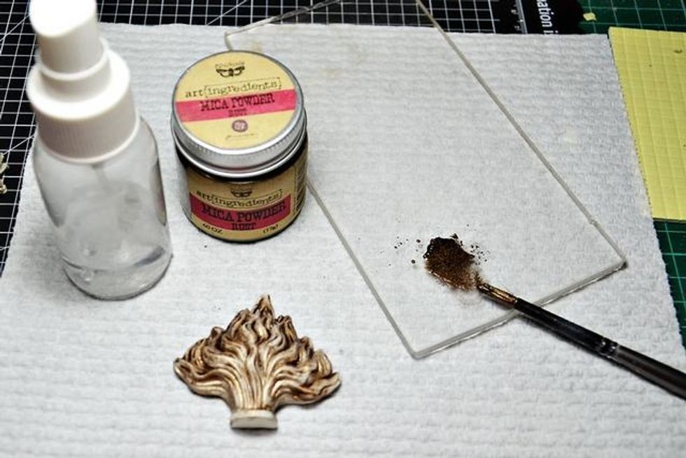 Mix Rust Mica Powder with a bit of water & paint the Flaming Heart resin pieces. Do not paint the center heart. Next use use R&A wings or cardboard wings. Paint those with the Rust Mica mix as well.