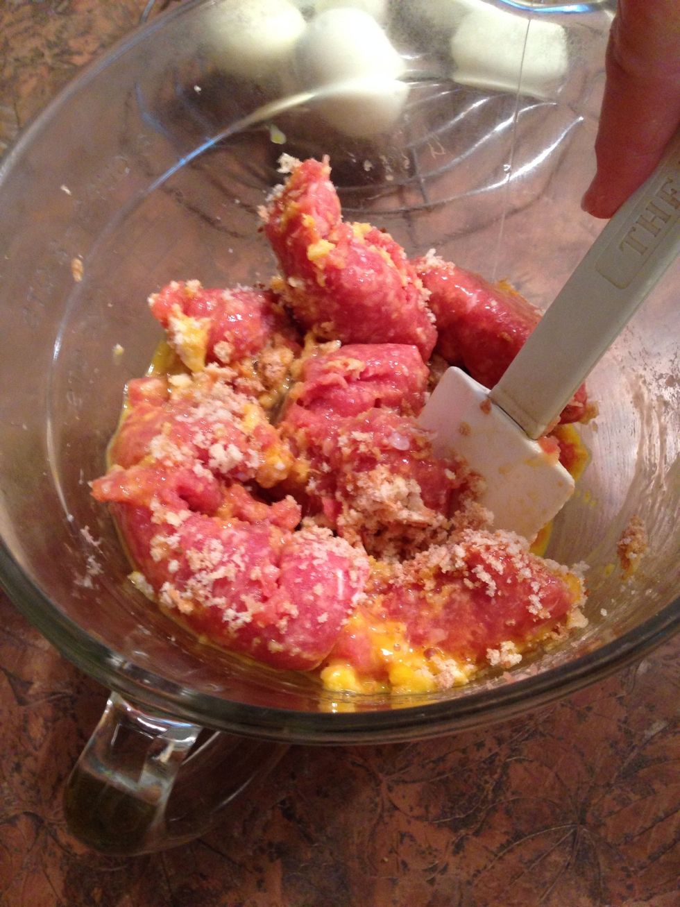 Mix sausage, 2 raw eggs and bread crumbs. I crumbled up a bun & slice of wheat bread... I actually added 2 or 3 extra T. of crumbs.