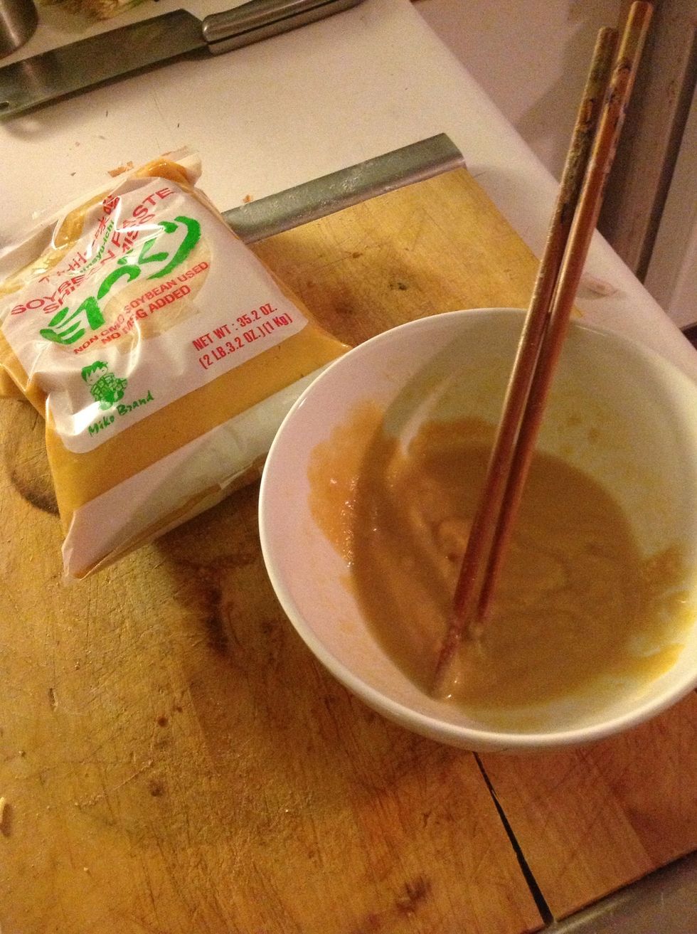 Mix some miso with a tiny ladle of the broth into a thin paste.