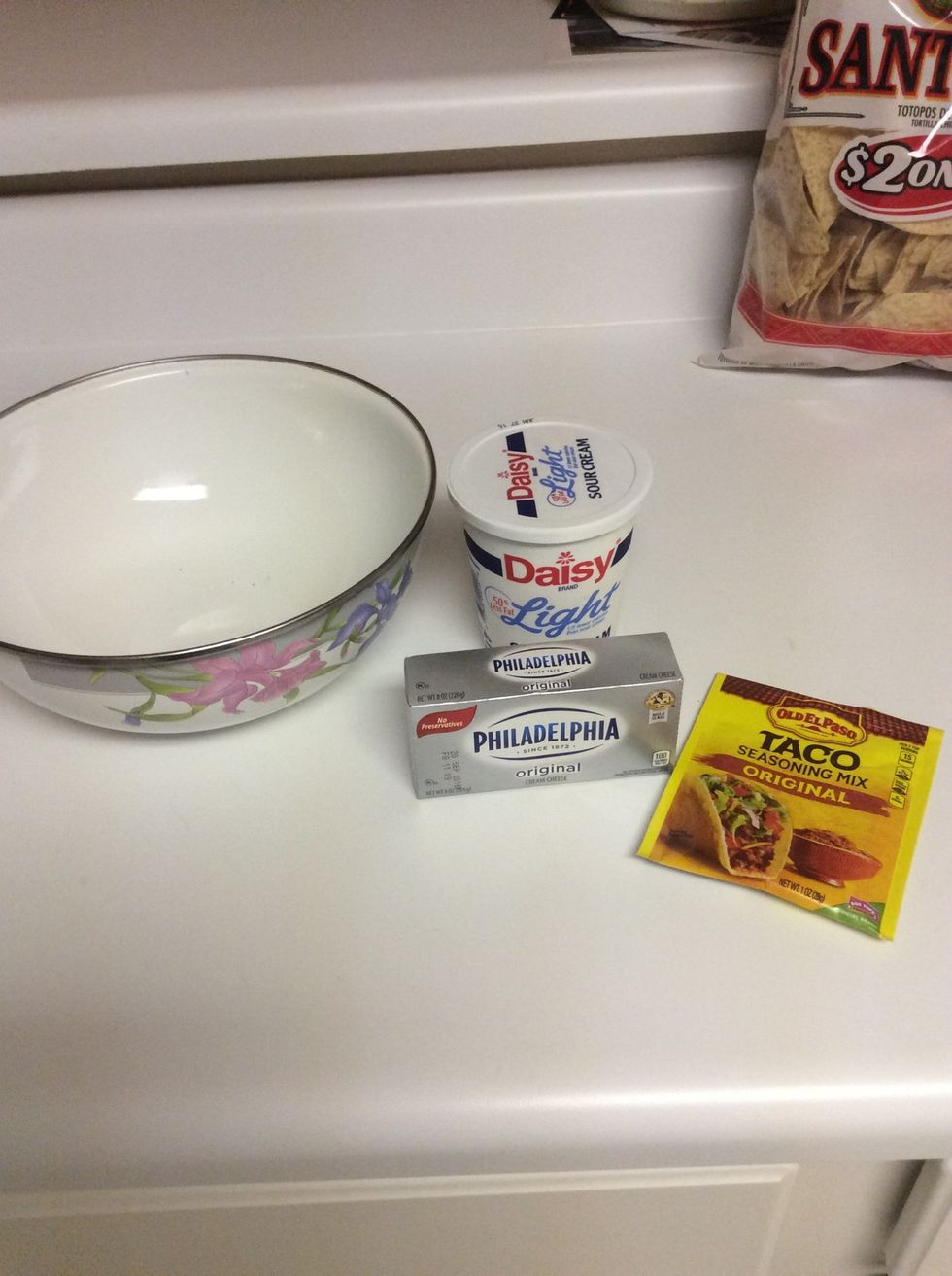Mix sour cream, cream cheese, and taco seasoning mix together
