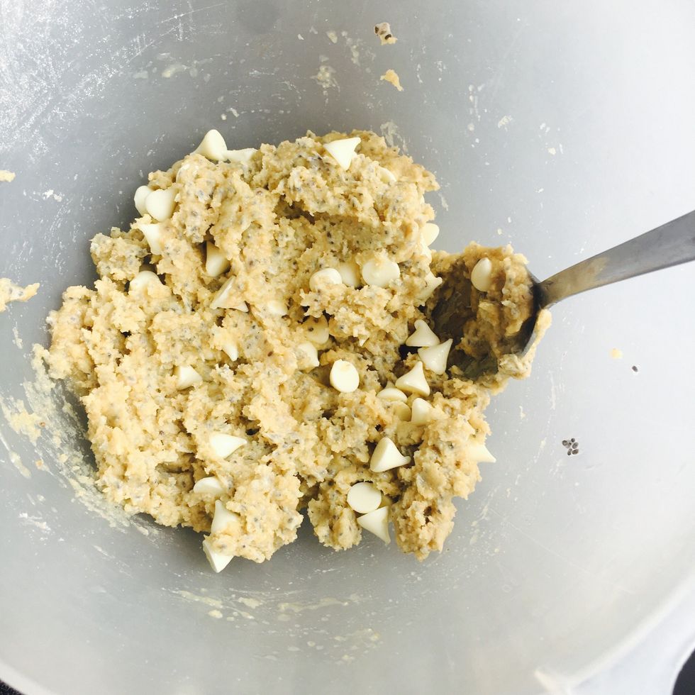 Mix soy flour,oat flour,coconut oil, (medium hard consistency), vanilla bean paste and a splash of almond milk in the blender. Transfer to a bowl & mix in the chocolate chips with a spoon.