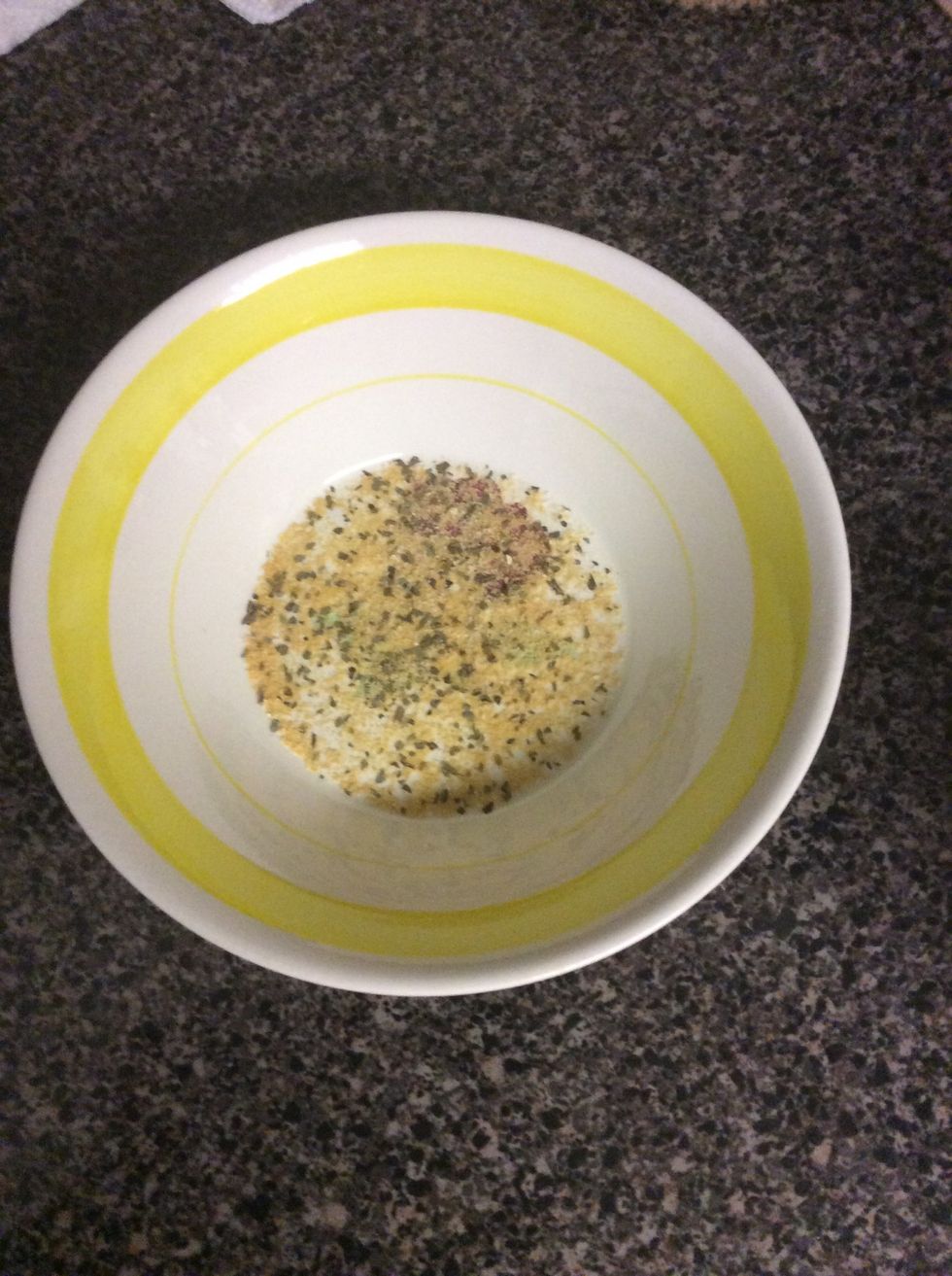 Mix spices being used in a bowl together