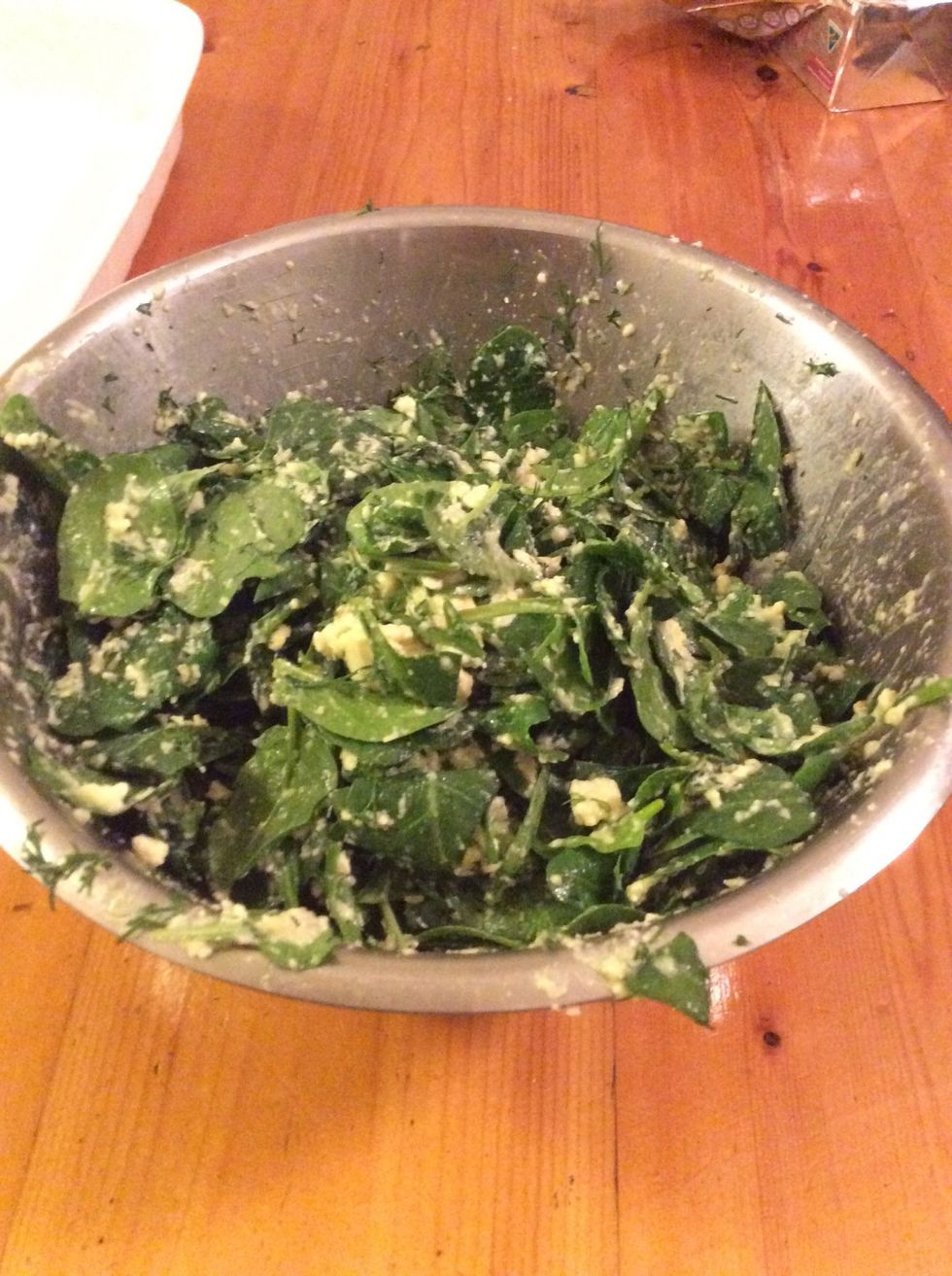 Mix spinach and dill into the cheese mixture, and make sure it is will combined. You might need to squash the spinach down a bit to fit in the bowl.