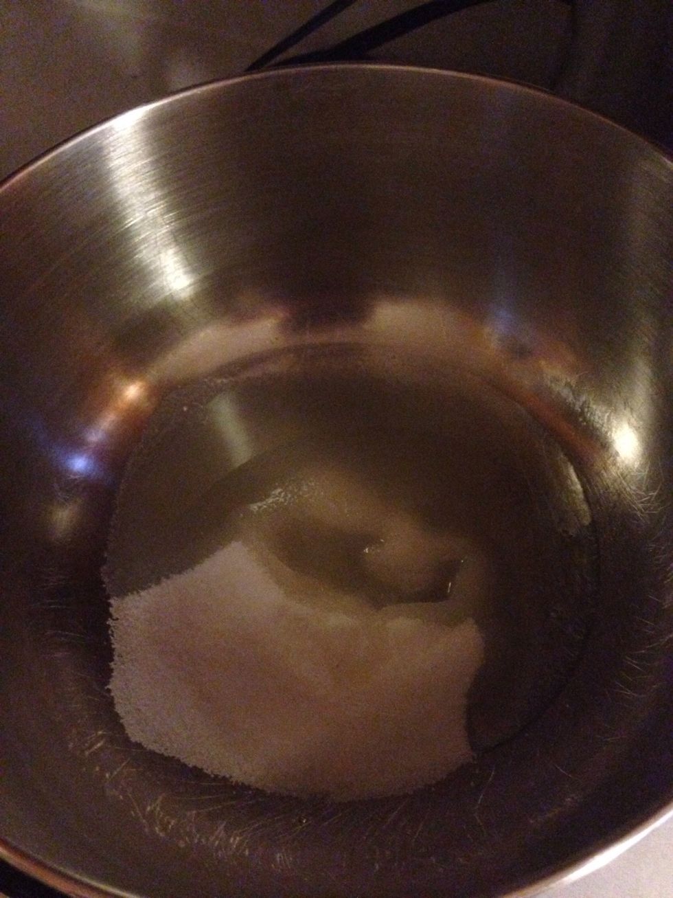 Mix sugar and oil together at a medium speed. Until blended