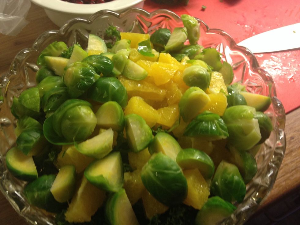 Mix the broussel sprouts with the kale and pieces of 2 oranges. The 3rd orange will be the vinaigrette.