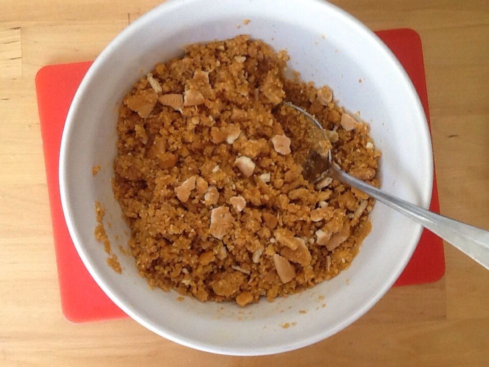 Mix the butter in with the biscuits so the biscuits are completely covered