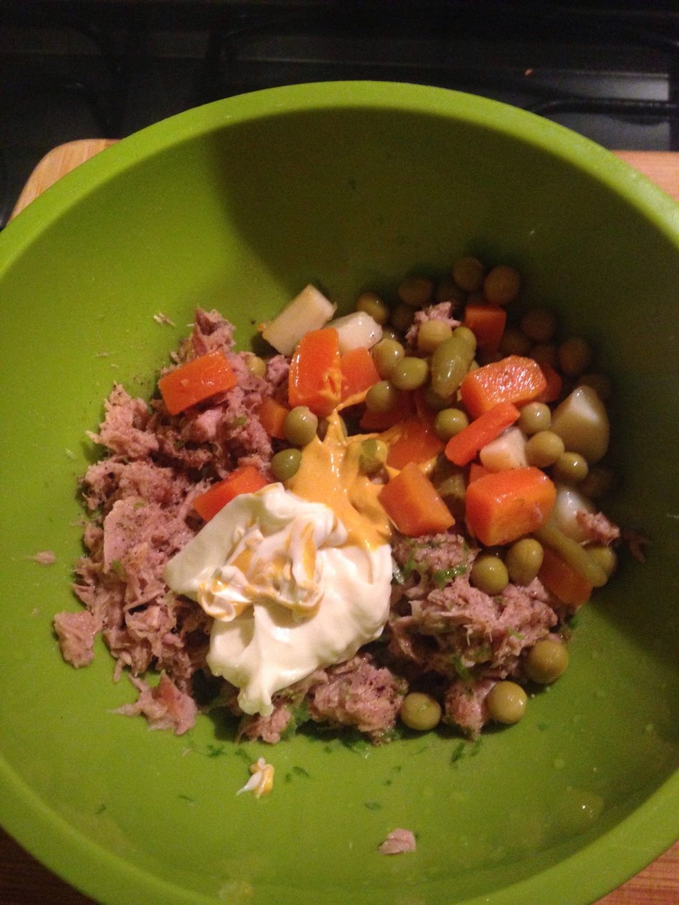 Mix the canned vegetable salad, mustard and mayo