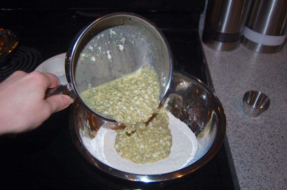 Mix the cheese mixture until ingredients melt together and then add it to the flour mixture.