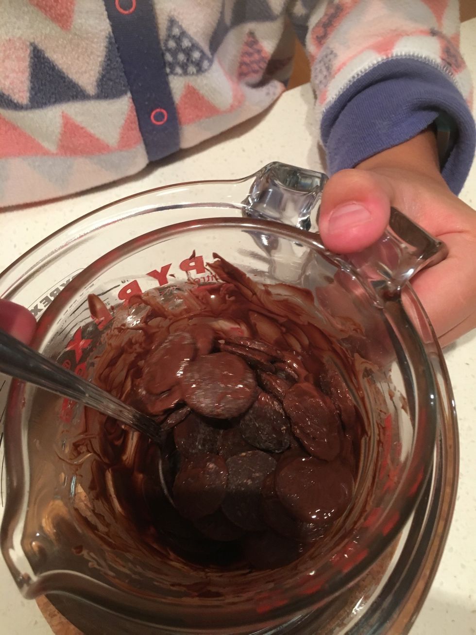Mix the chocolate until melted, you could also melt the chocolate in the microwave.