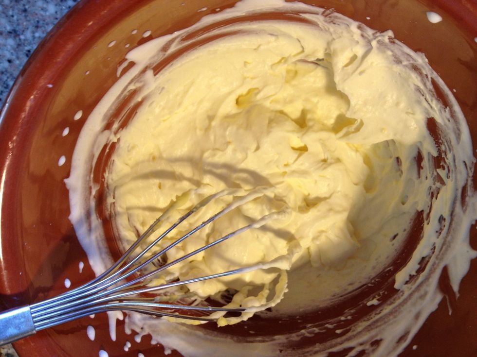 Mix the cold hollandaise in to the cream. Don't over work it, just make sure that they are blended into one another.