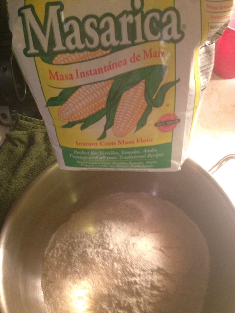 Mix the corn flower alternating between warm and cold water to a pizza dough-like consistency - with your hands-