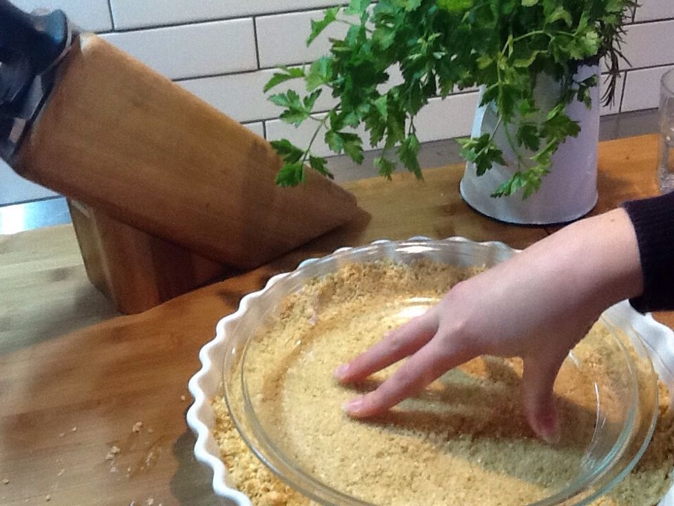 Mix the crumbs and butter together and press it down into the tart case making sure it goes up a bit at the sides.