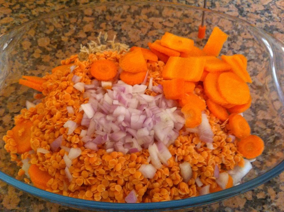 Mix the dry ingredients in an oven dish and add in spices as you prefer or you can just leave the stock do its magic later