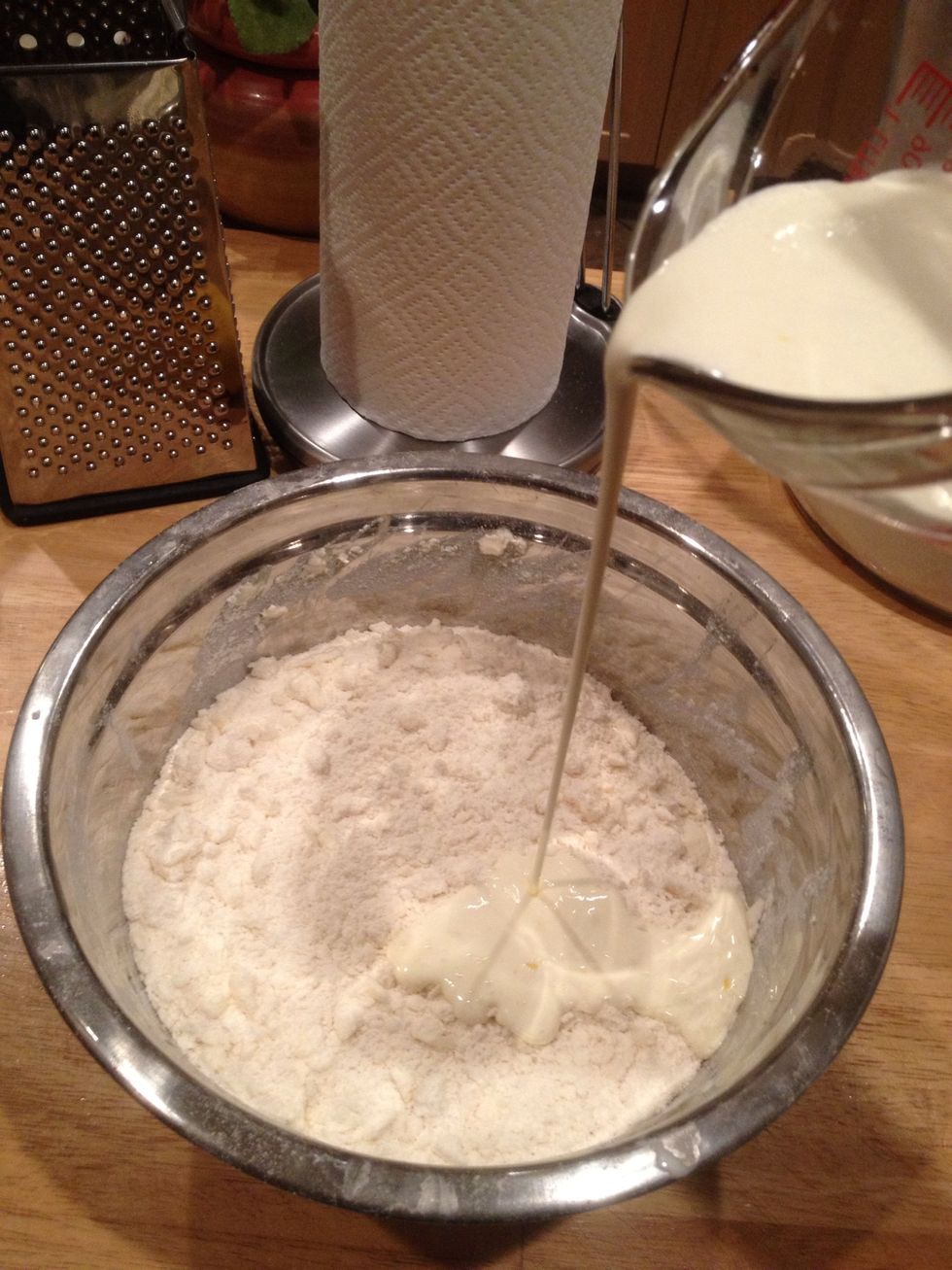 Mix the egg and zest into the cream using a fork.. Add the wet into the dry using the same fork to combine. Do so in 2 intervals.