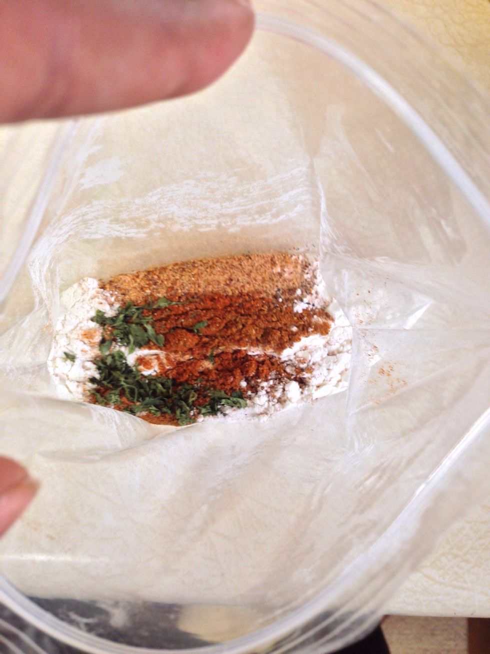 Mix the flour and preferred seasonings in Ziploc bag