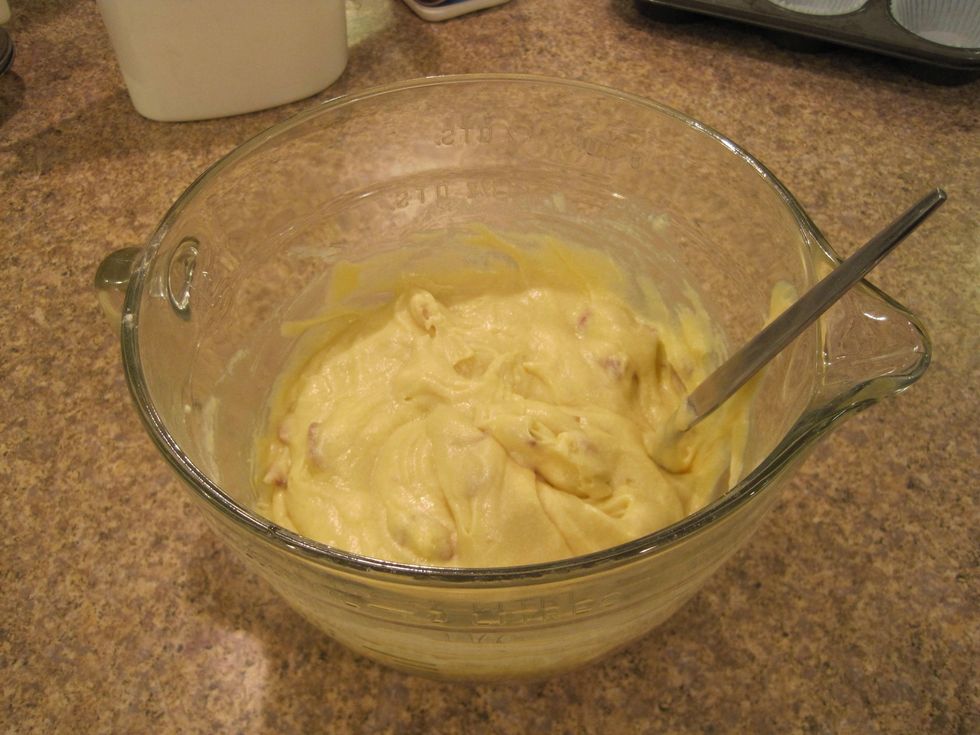 Mix the flour, baking soda, butter, sugar, eggs, maple syrup, and milk with a beater until smooth. Stir in all but 2 Tbsp of bacon (set the rest aside for later).