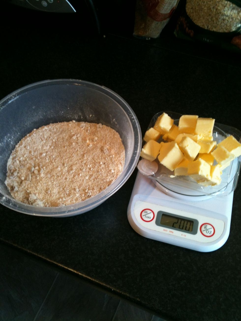 Mix the flour, sugar and oats in to a bowl. Cut the butter in to cubes. This makes it easier to rub in to the mix.