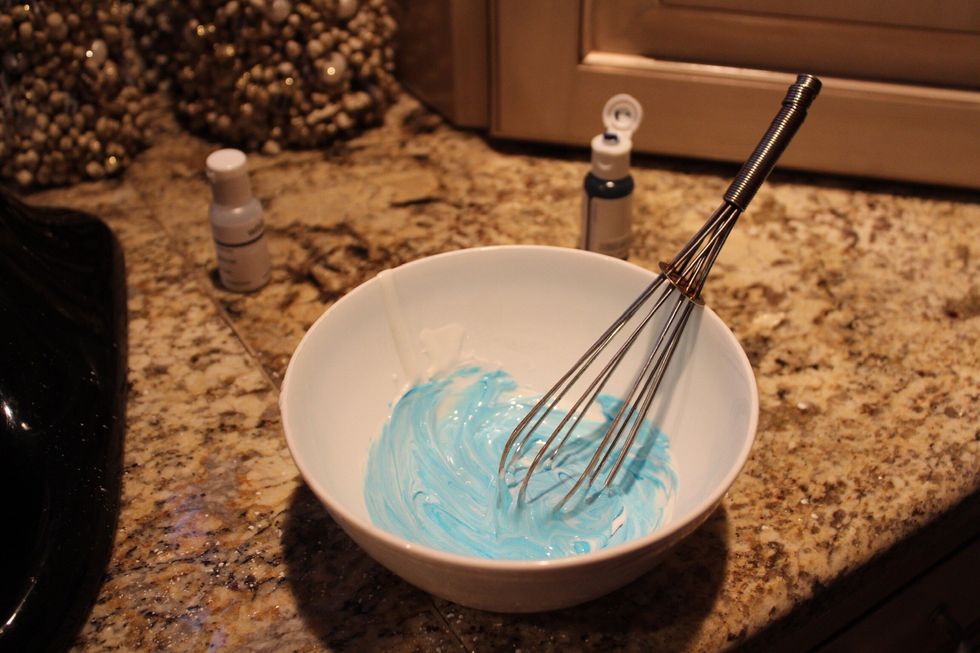 Mix the food coloring and icing until the icing is that color