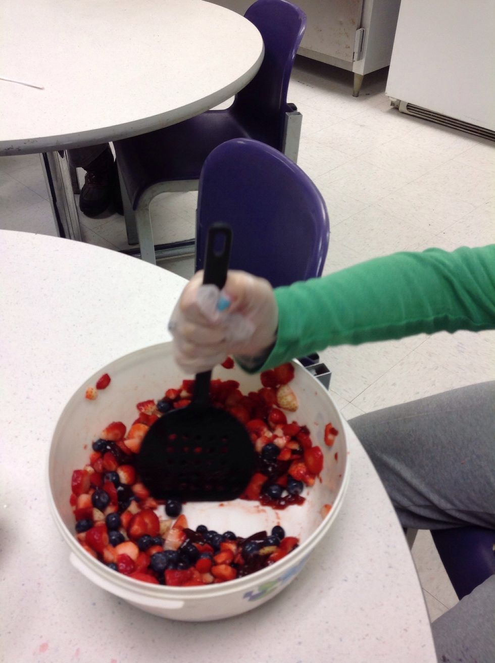 Mix the fruits and the spread together. Mix it we'll