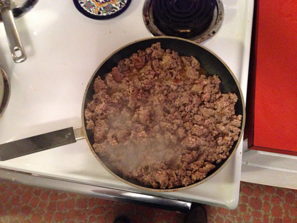 Mix the ground beef and sausage together and brown. Then use a colander to drain the fat. Set aside in your sauce pot.