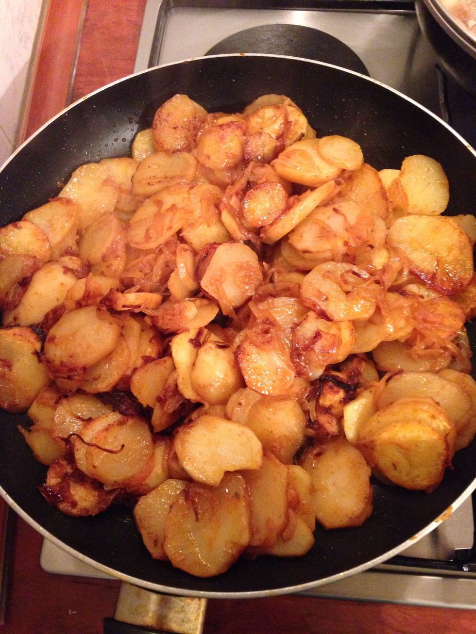 Mix the potato from time to time for not get the onions burn , otherwise they will change the colour into black and won't taste good