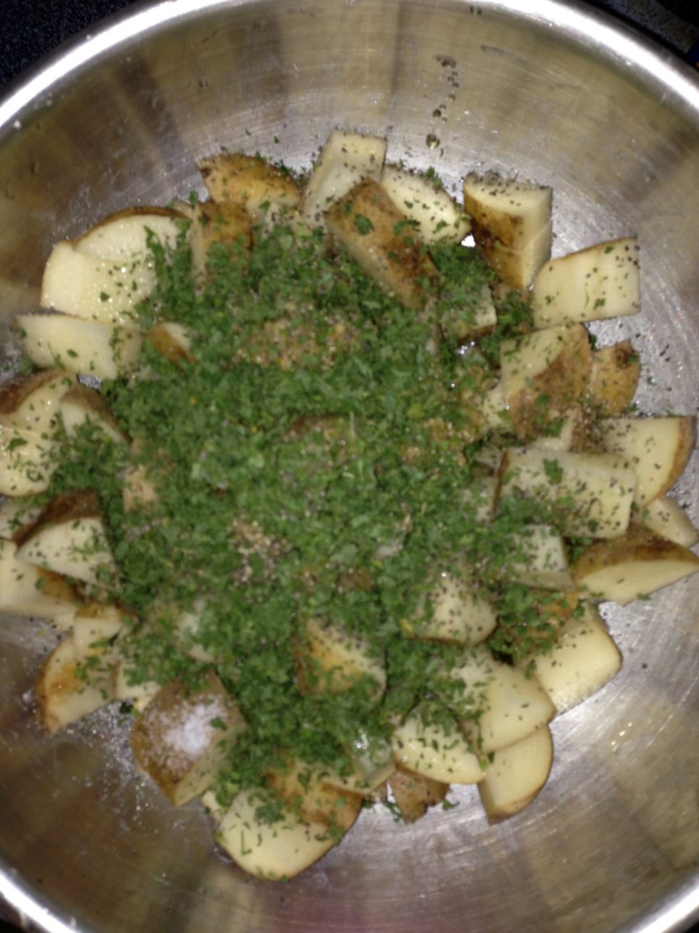 Mix the potatoes and other ingredients in a bowl. Make sure all pieces are coated with the oil and you have the seasonings mixed thoroughly.