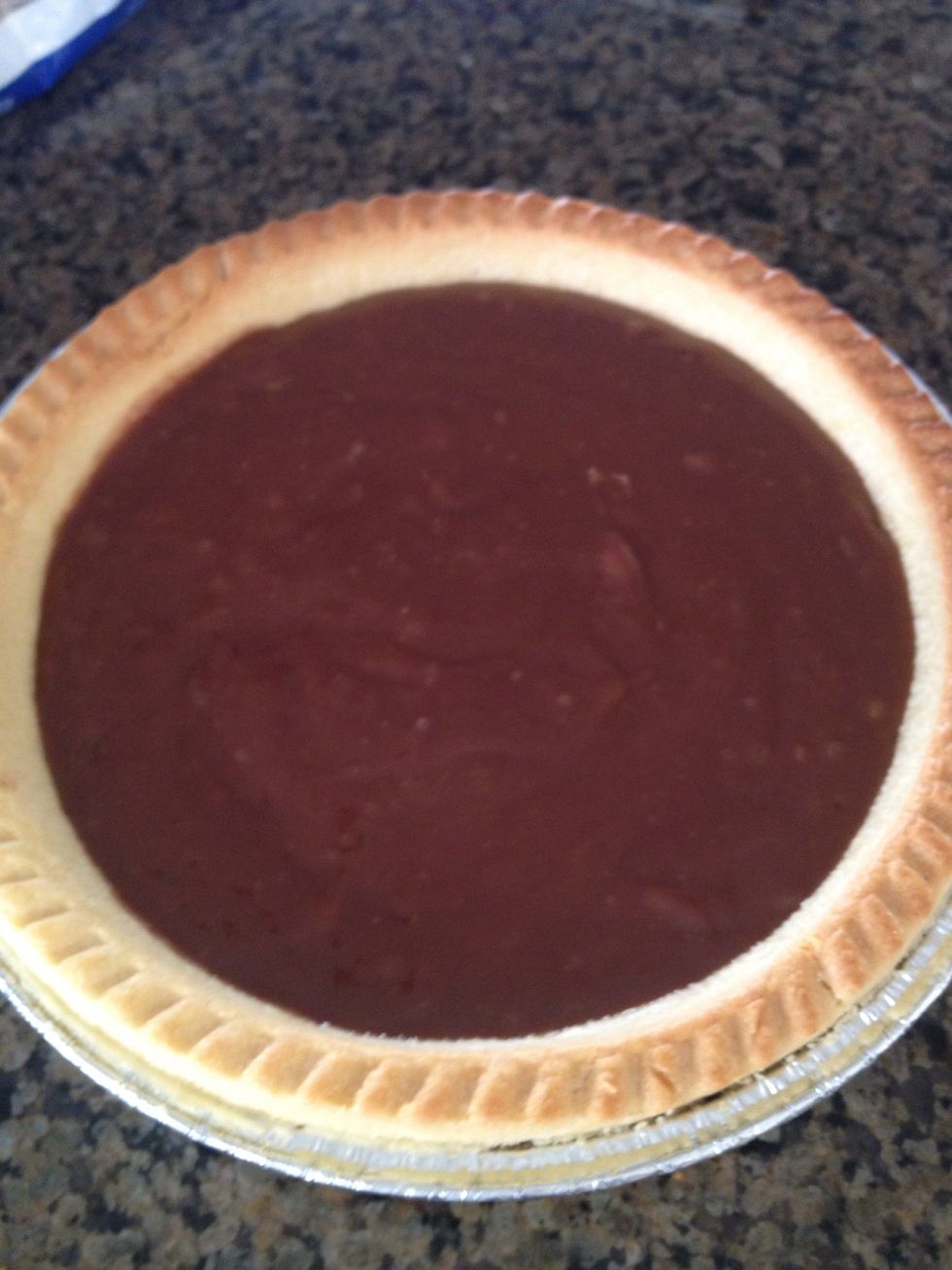 Mix the previous mixture with chocolate and egg yolk..pour it into the pie shell and let it chill for an hour (note: the pie shell had baked for some minutes until brown)