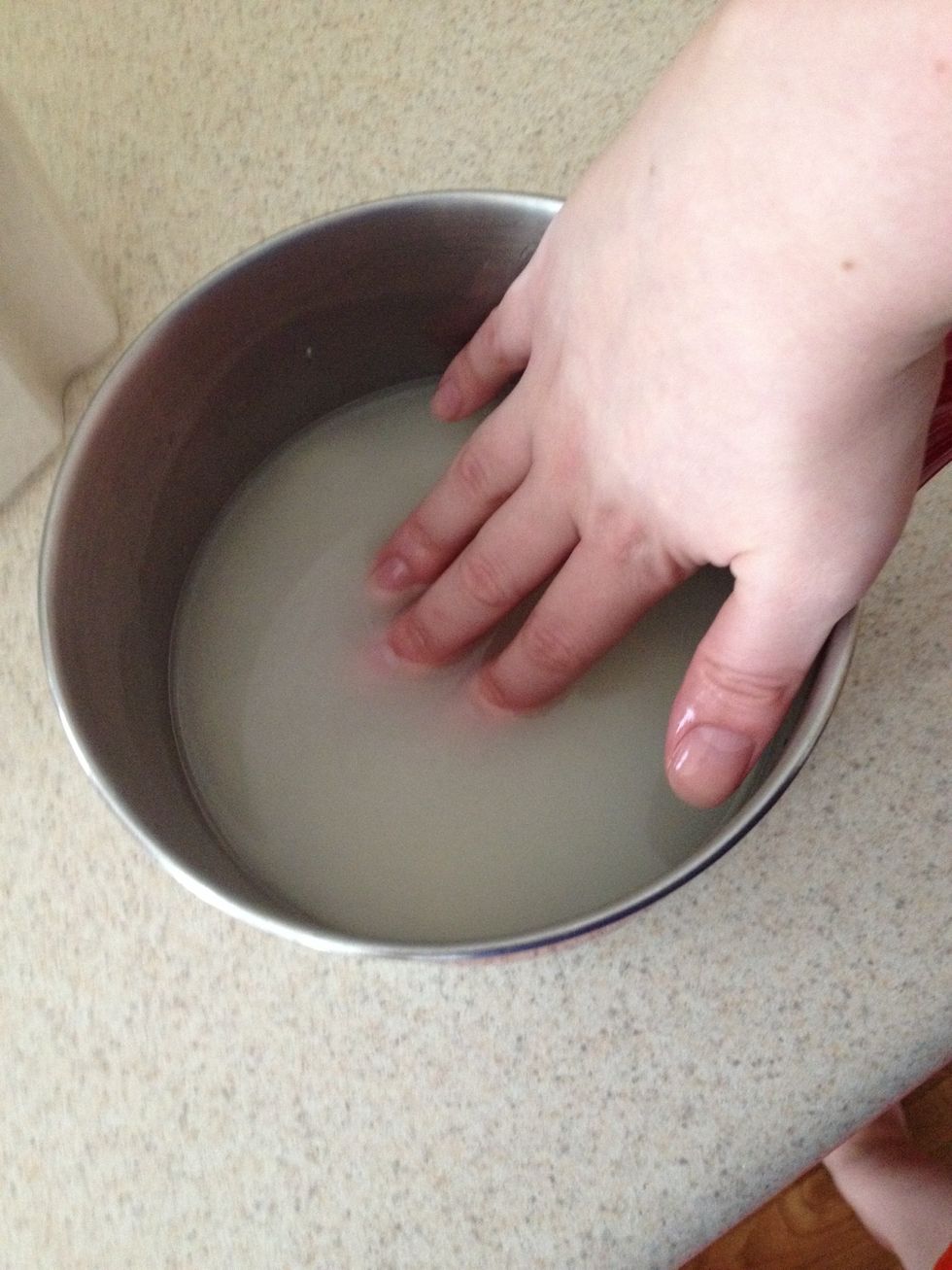 Mix the rice & water with your hands. The water will be cloudy which is what we don't want! So drain the water carefully & repeat until the water is clear even with you mixing the rice & water.