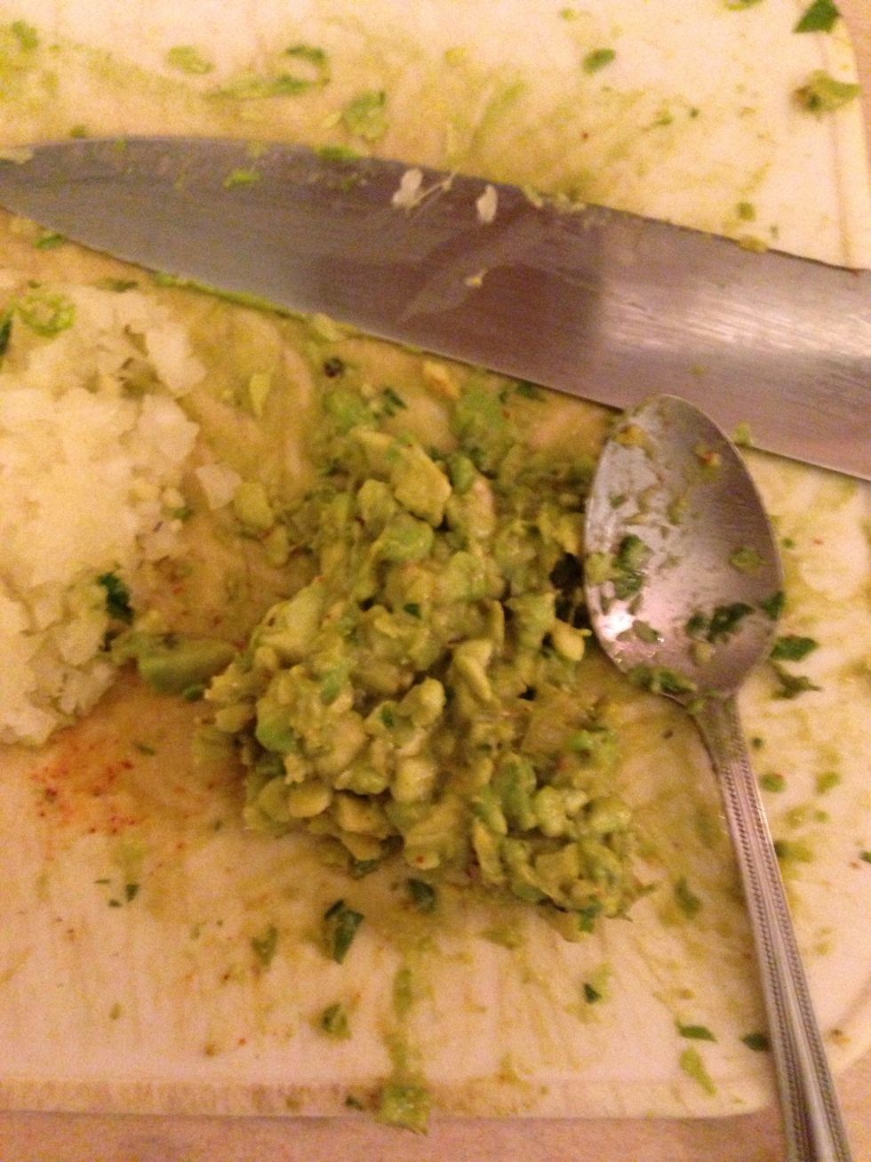 Mix the salad and avocado and add a little onions and salt to make some guacamole. Add a hint of lemon for some extra flavor.