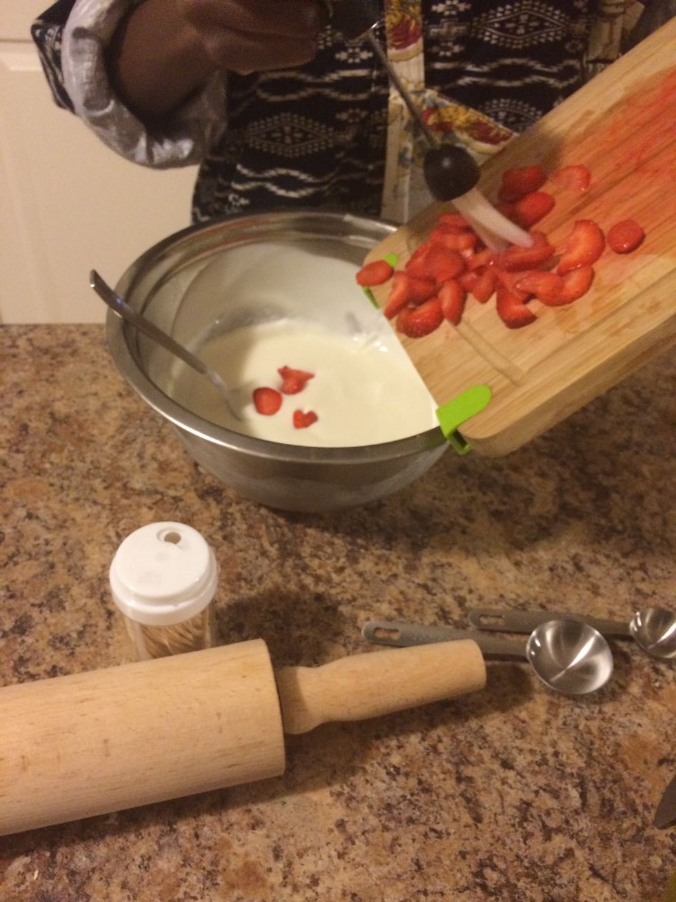 Mix the strawberries into the yogurt