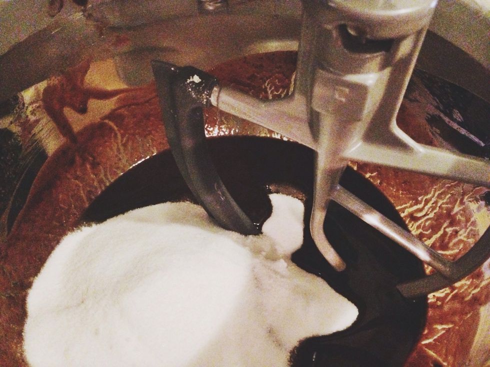 Mix the sugar and melted chocolate mixture in the bowl of an electric mixer on medium speed until combined, about 1 minute.