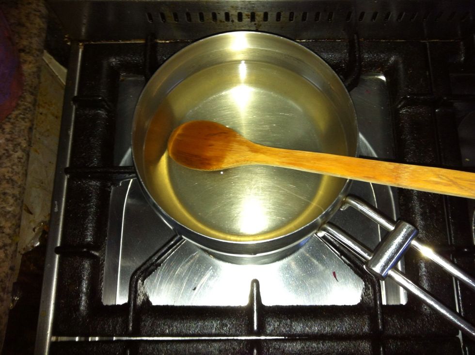 Mix the sugar w/ the remaining cup of water over low heat untill the sugar disssolves completely. ( it helps to start with very hot water). Once the sugar is fully dissolved, proceed to the next step.