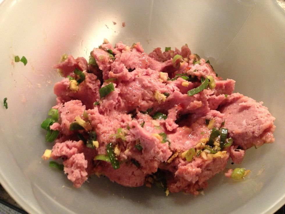 Mix the turkey meat and 3/4 of the garlic, ginger, and green onion (leaving some for saut\u00e9ing the mushrooms). Also add 2 Tablespoons of soy sauce, salt and pepper