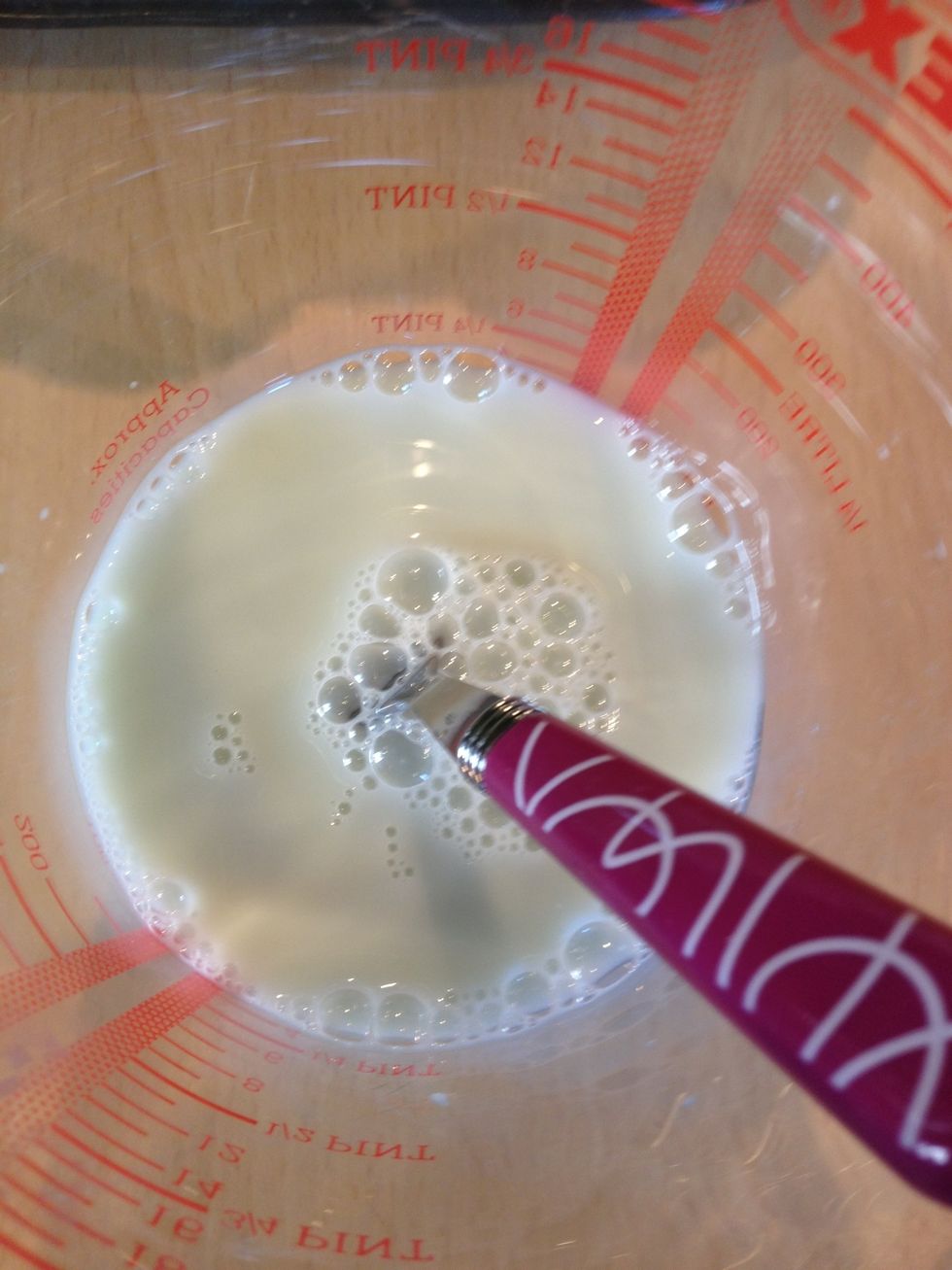 Mix the violet syrup in with the milk.