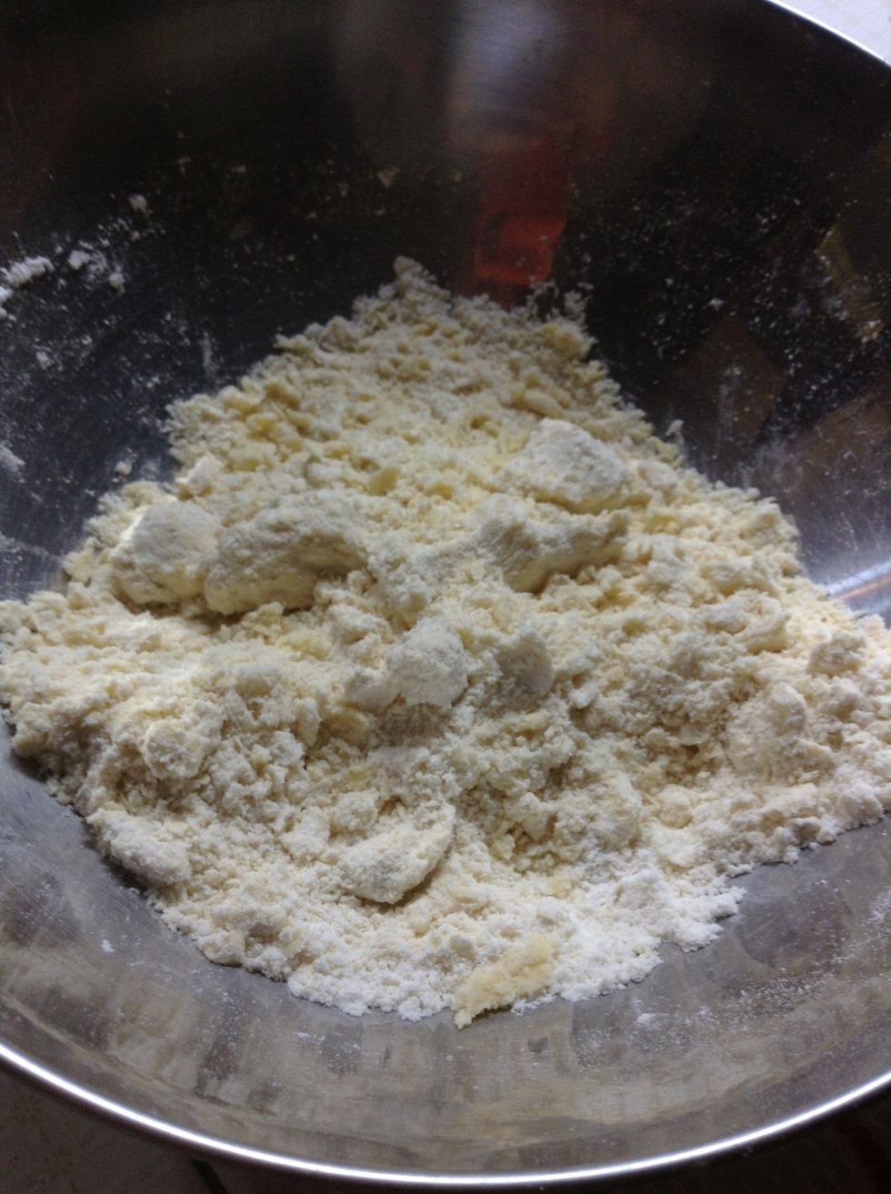 Mix the whole thin together, either with hands or a spatula. Make sure the butter cubes mix well.