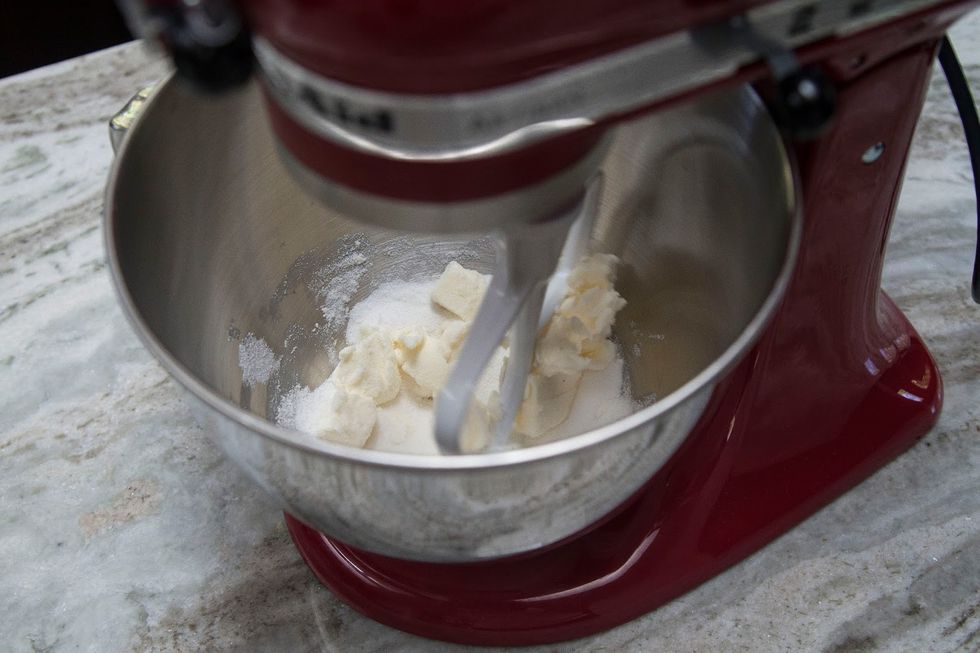 Mix them together slowly until they're pale yellow and fluffy, this takes about 3 minutes.