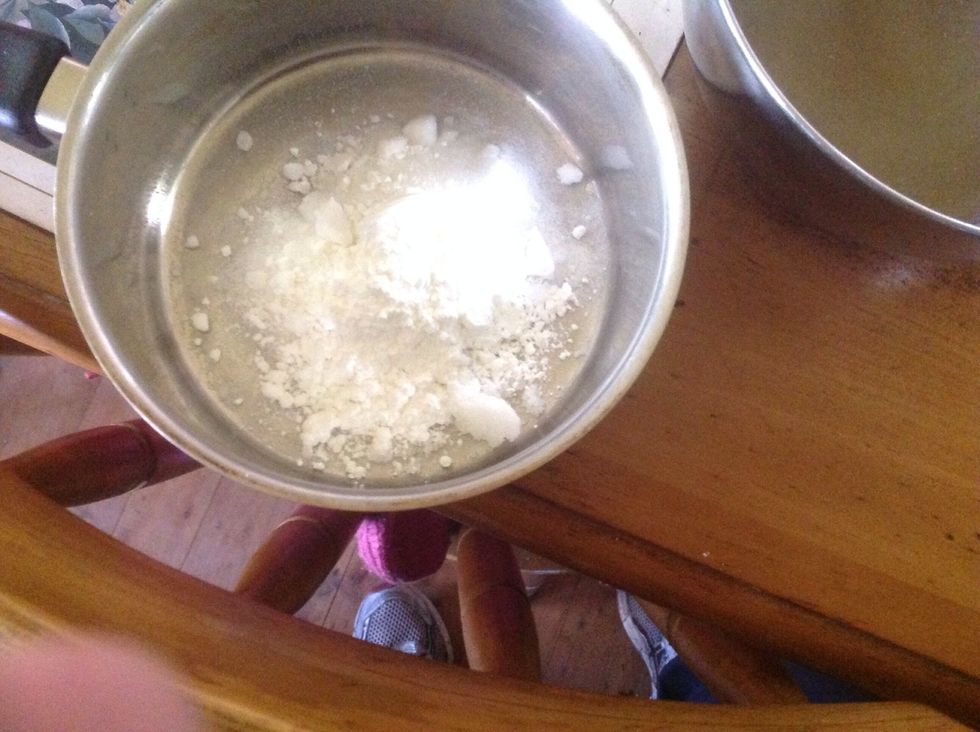 Mix together 1/4 cup of sugar and 2 tablespoons of cornstarch in a saucepan