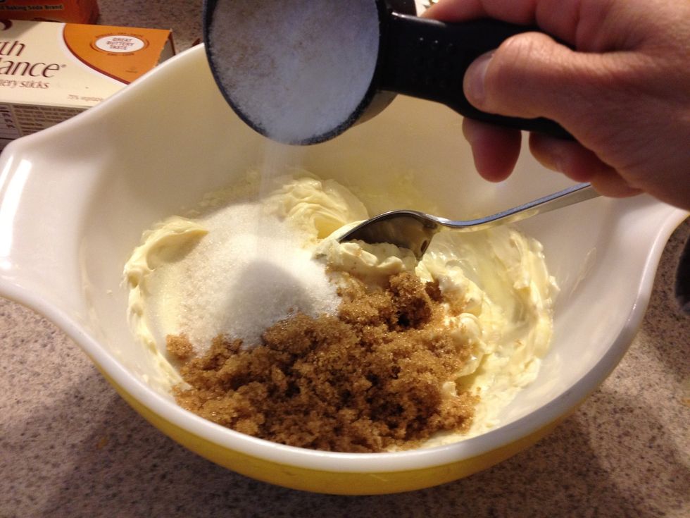 Mix together 1 cup margarine, 1/2 cup brown sugar and 1/2 cup white sugar until creamy.