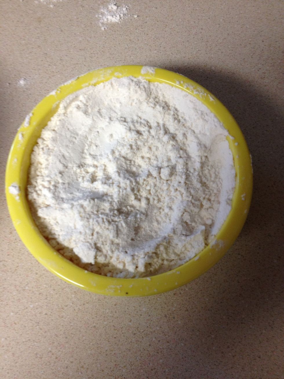Mix together 1 cup of flour, salt, sugar, and yeast (save the rest of the flour for later)