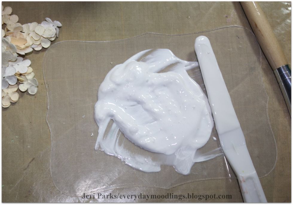 Mix together matte medium, iridescent medium and a small amount of white paint. The more iridescent medium you use the more it will shimmer.