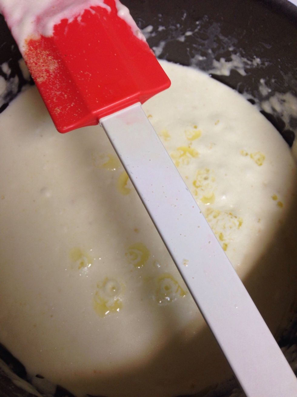 Mix together on medium heat in this order: butter, cream cheese, milk, Parmesan cheese, and lastly garlic to taste. Leave on low once made into a thick sauce.