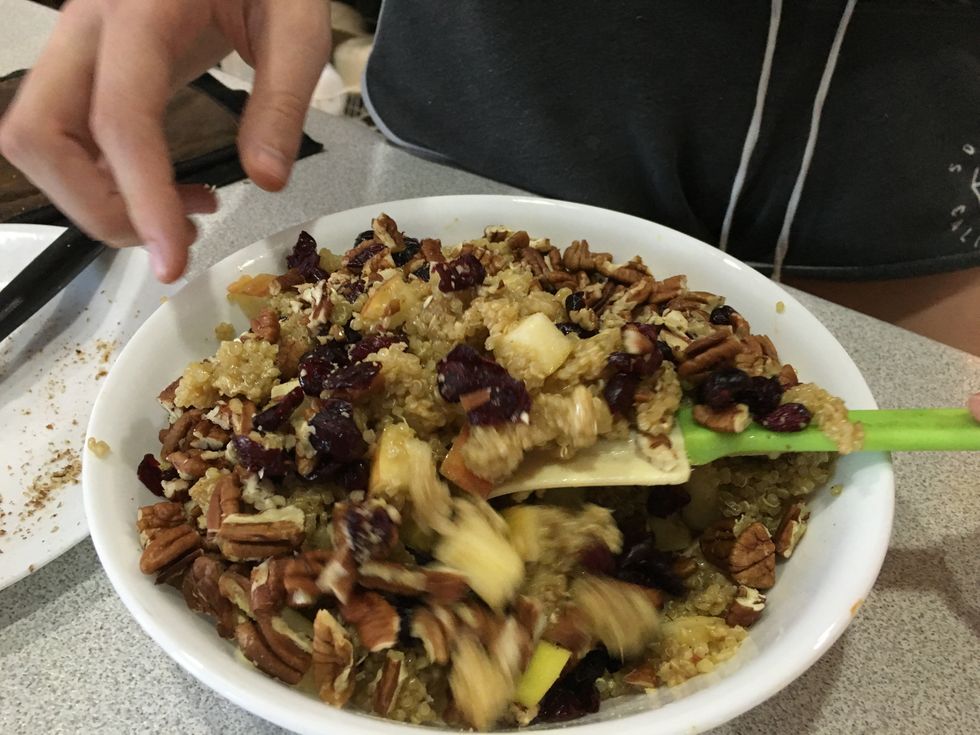 Mix together the dijon mixture, quinoa, apple pieces, dried cranberry and pecan pieces