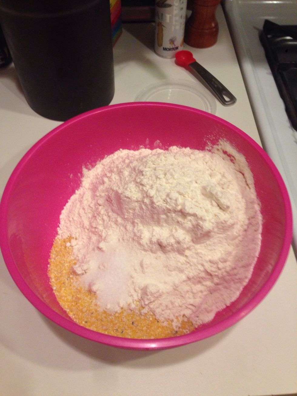 Mix together the dry ingredients: 1/2 cup of uncooked finely  ground polenta (aka cornmeal), 1.5 cups of flour, and 1/2 teaspoon of salt.