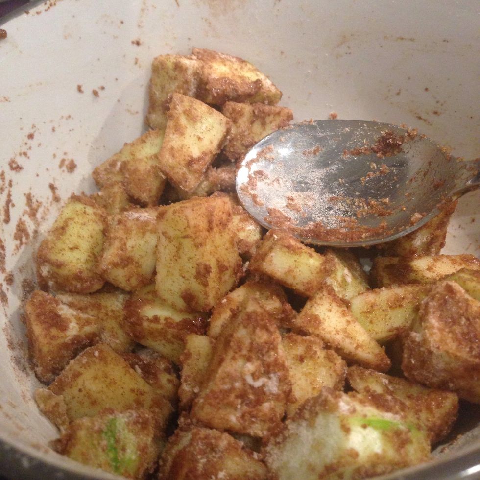 Mix together the peeled and diced apple, flour, cinnamon, sugar with a teaspoon of water