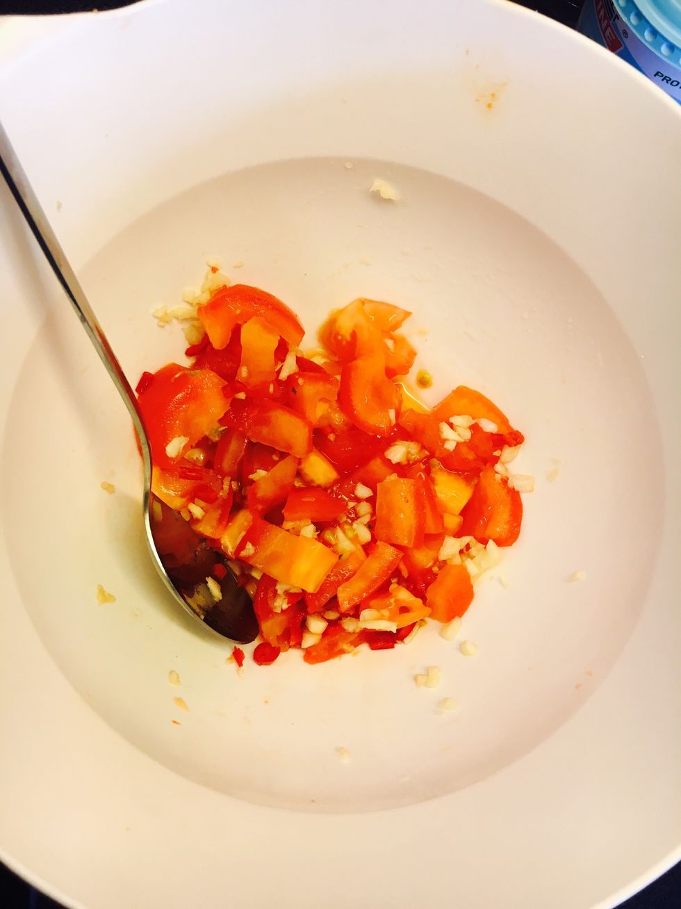 Mix together tomatoes, garlic and chili