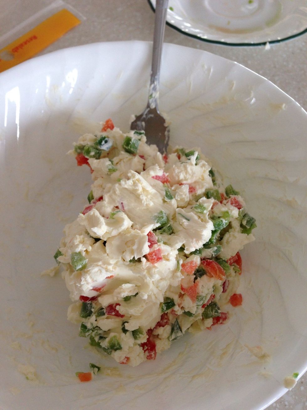 Mix together until peppers are evenly distributed throughout the cream cheese.