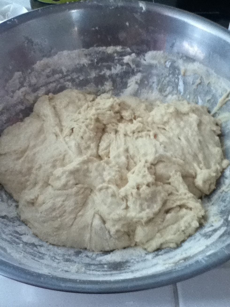 Mix together with wooden spoon. Dough will be very sticky. When it looks like this it is ready to start rising. I was lazy so I didn't put the dough in a new bowl but either way works