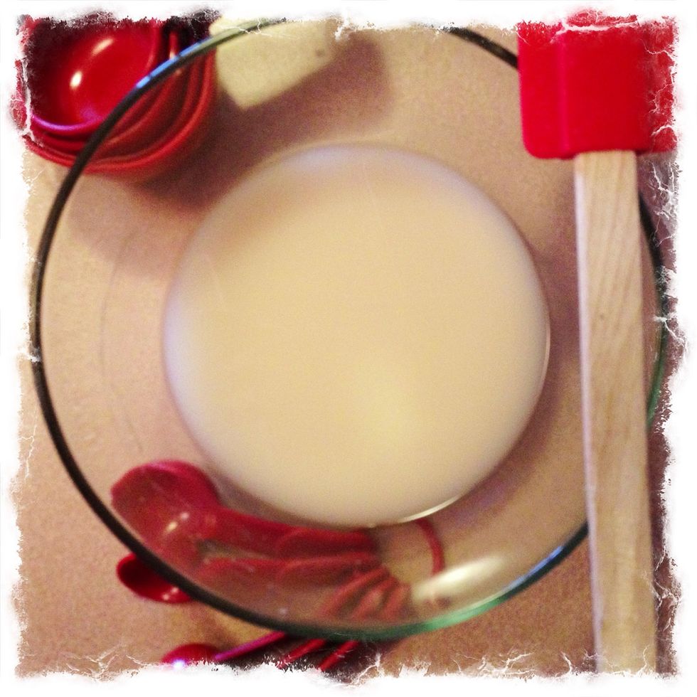 Mix together yeast and warm water.  Slowly stir until the yeast has dissolved.